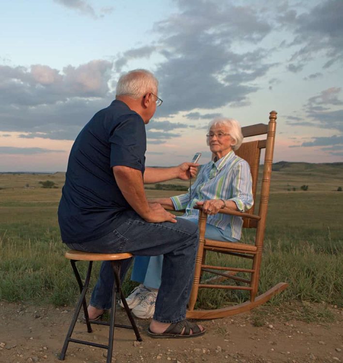 Jim Puppe interviews Pauline (Koch) Roll outside her home in Heil, ND, Grant County.